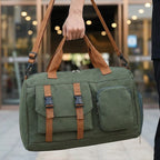Sports duffel bag with shoe pocket carried over shoulder