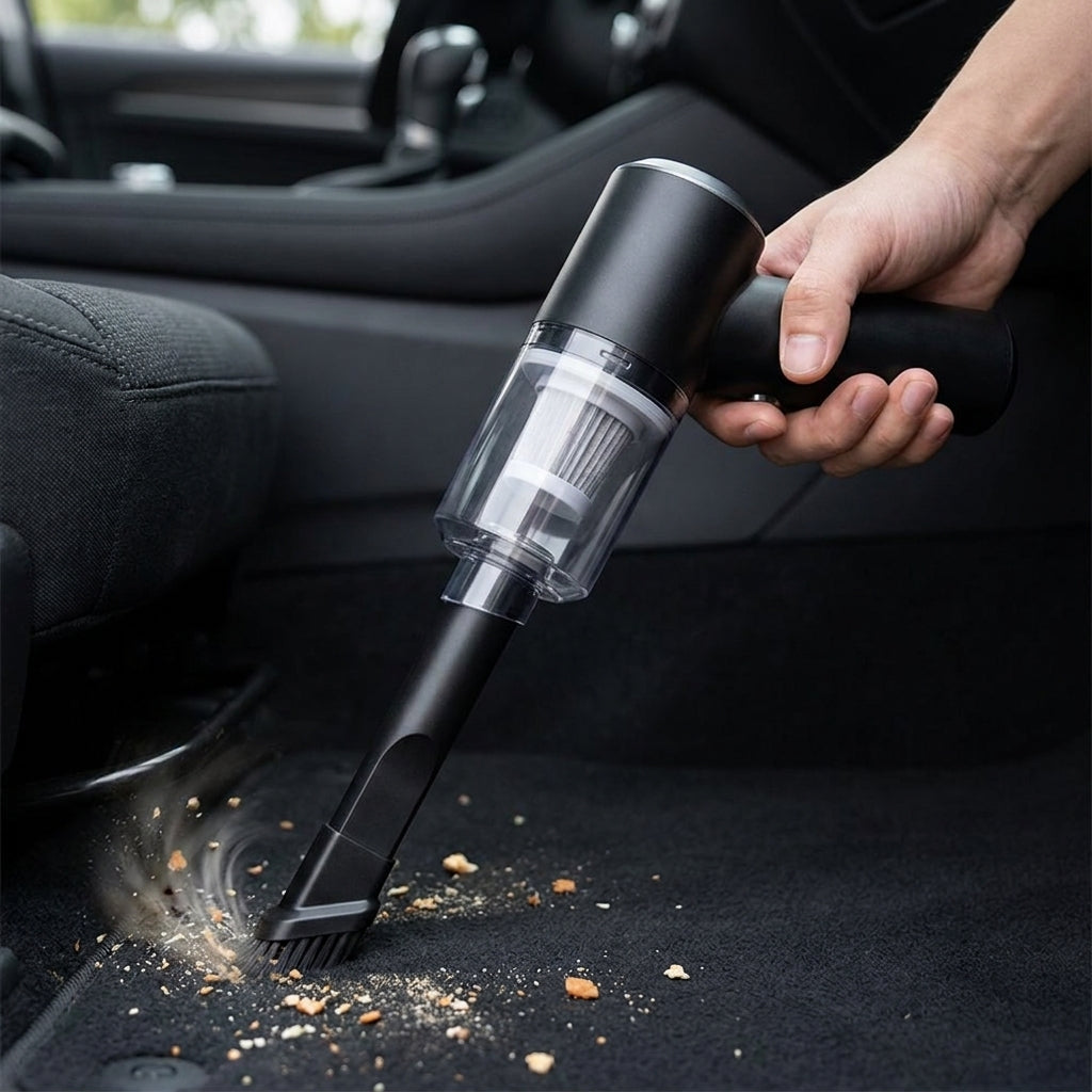 Handheld car vacuum cleaner in use — cleaning car interior