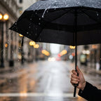 Windproof travel umbrella in use in the rain