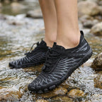 Quick-dry water shoes in use — wading through water