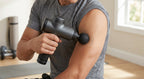 Percussion massage gun in use on shoulder